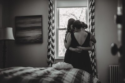 Sisters sharing a moment before the ceremony